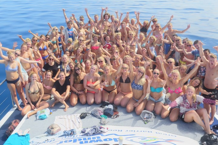 a group of people swimming in a body of water